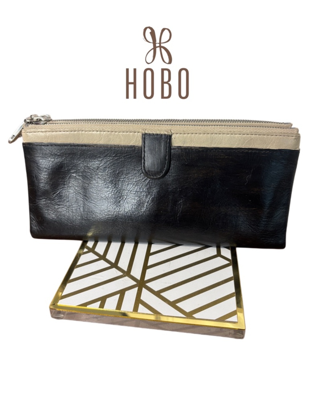 HOBO brand Taylor two-tone leather clutch wallet.